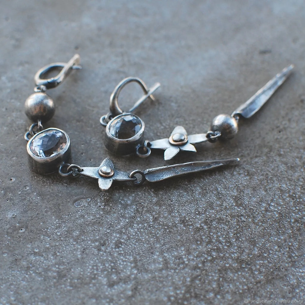 Pair of long geometric pendant earrings with rhinestones in antique silver colour