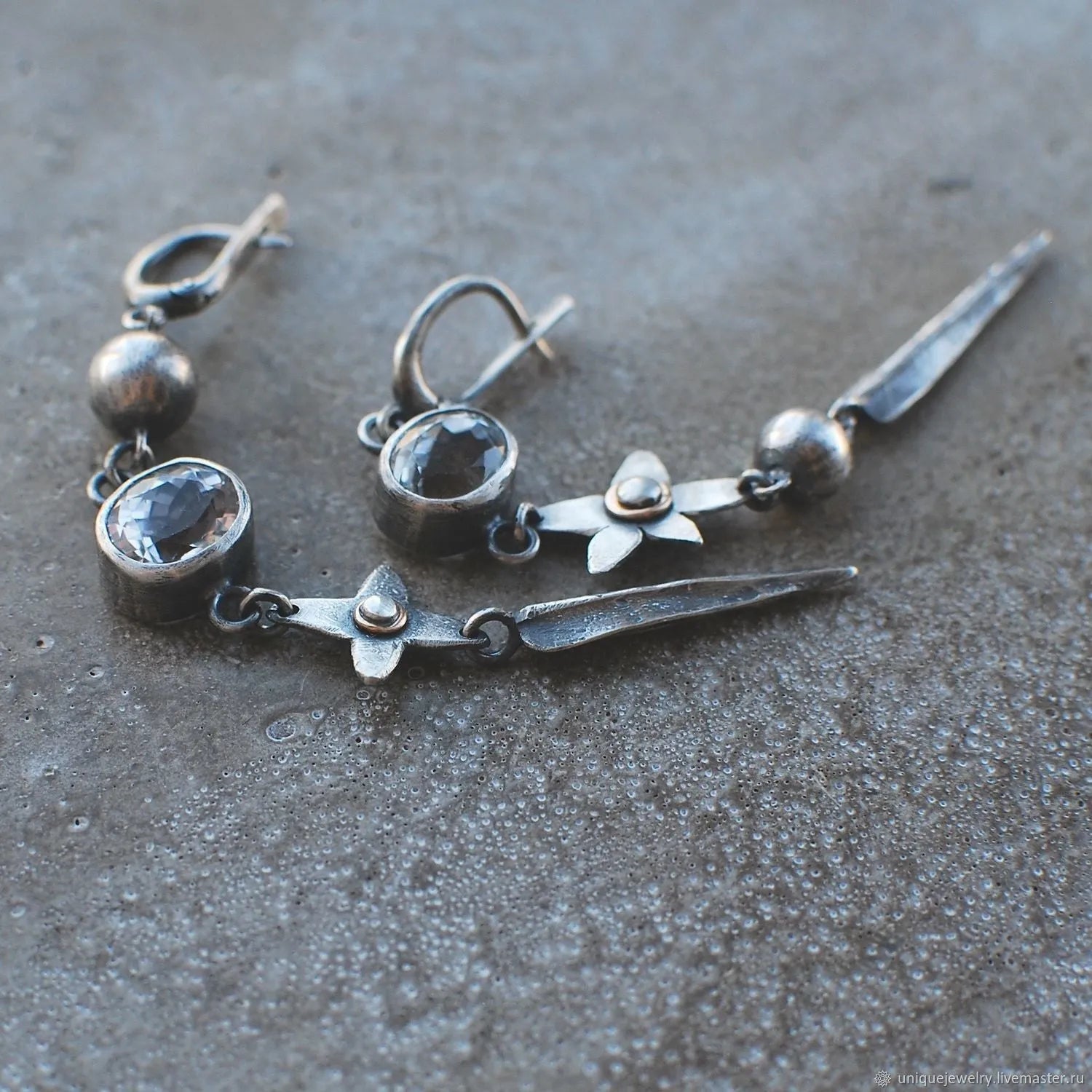 Pair of long geometric pendant earrings with rhinestones in antique silver colour