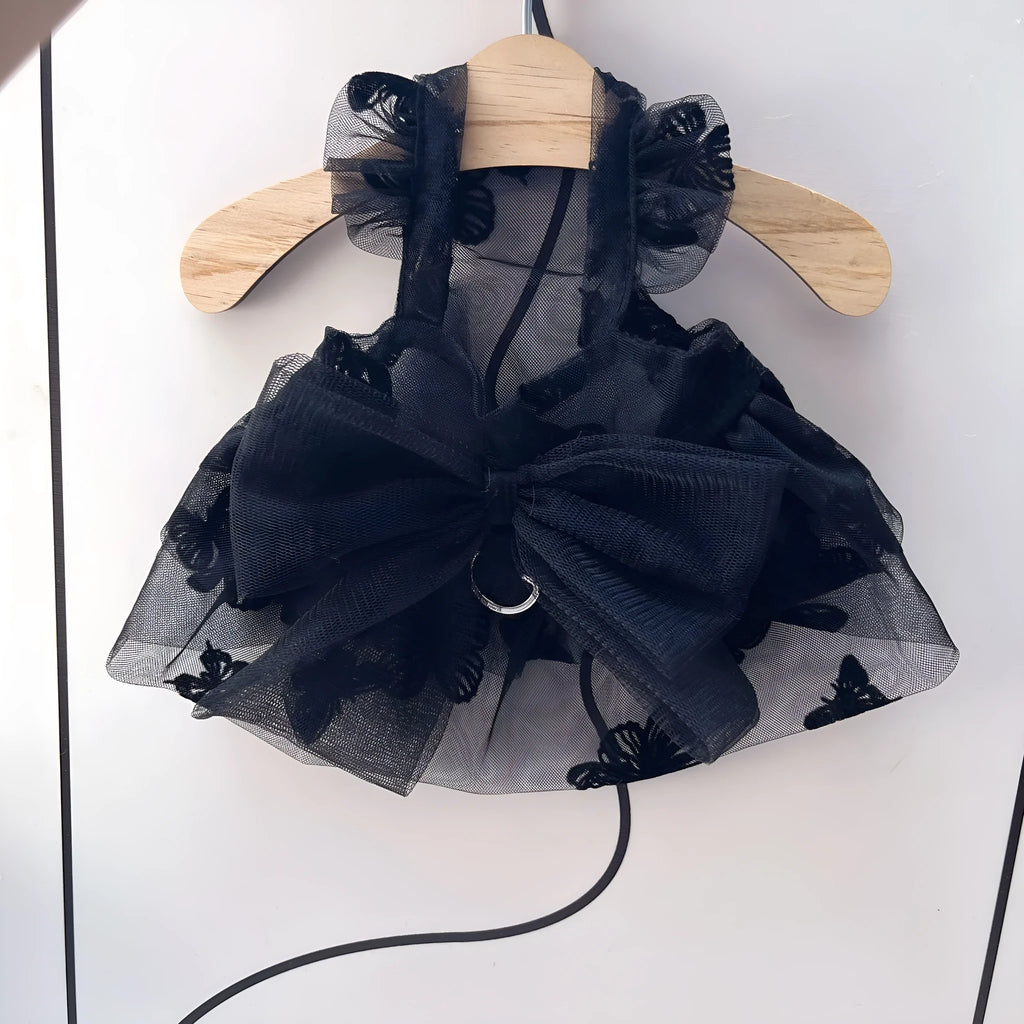 Black polyester tulle princess skirt costume for a small dog or cat on a mannequin, showing the gauzy fabric.