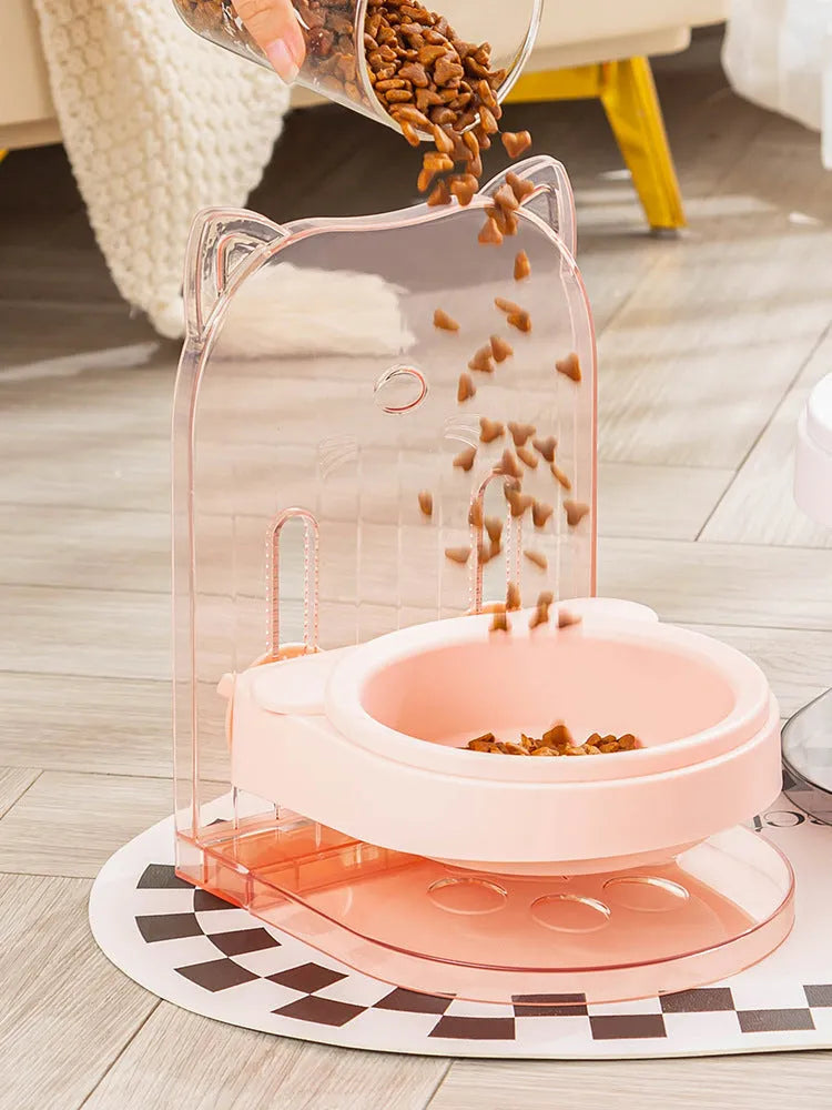 Grey pet bowl with cat ear sides, shown with adjustable height stand and removable cage attachment.