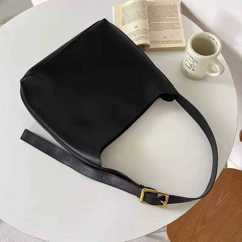 Women's soft PU shoulder bag with swing threads in 28x32x12cm size