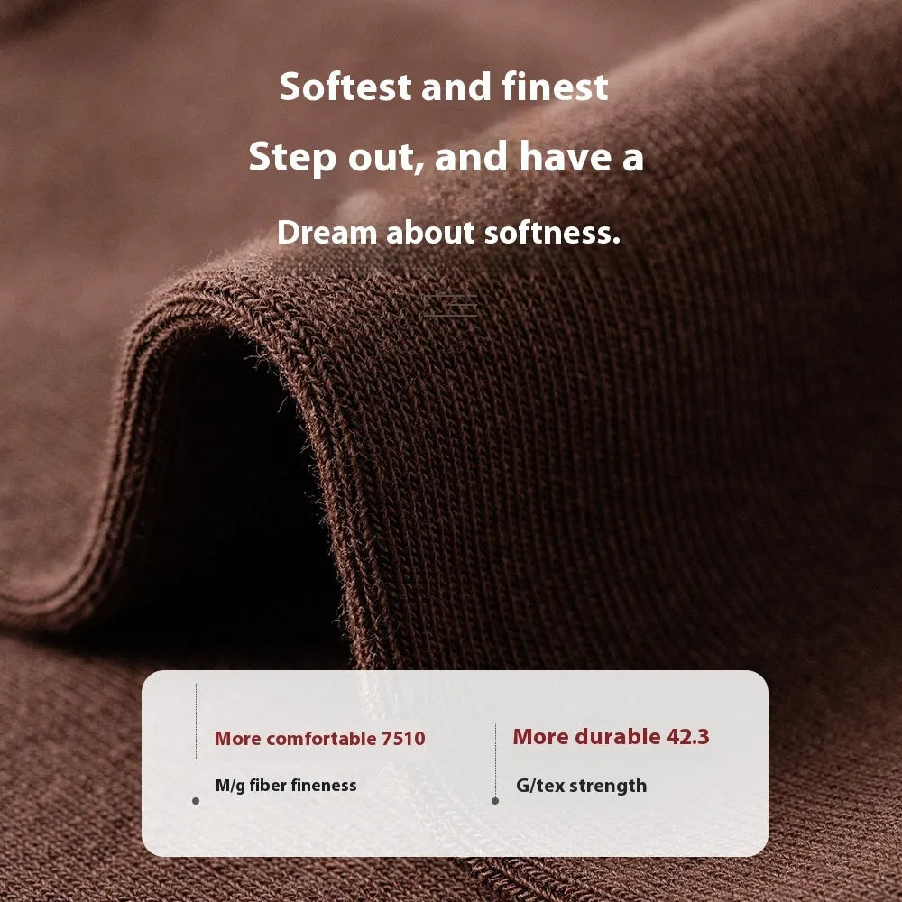 Solid colour mid-calf men's business socks in combed cotton on a white background.