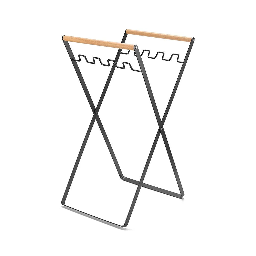 Black iron folding trash storage rack with wooden carrying handles