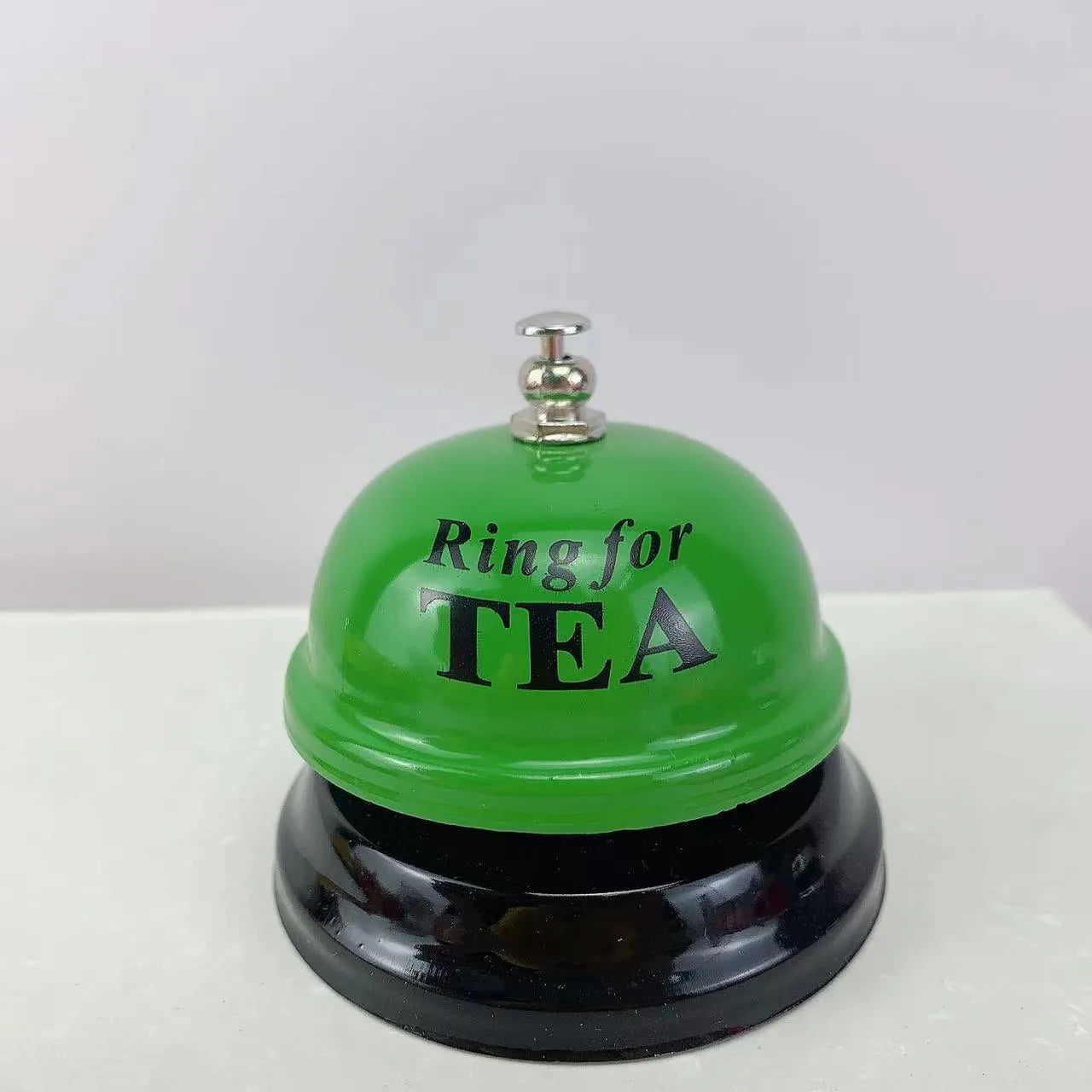 Handheld iron game bell in one of ten colours like red, blue, or green tea, for classroom or restaurant use.