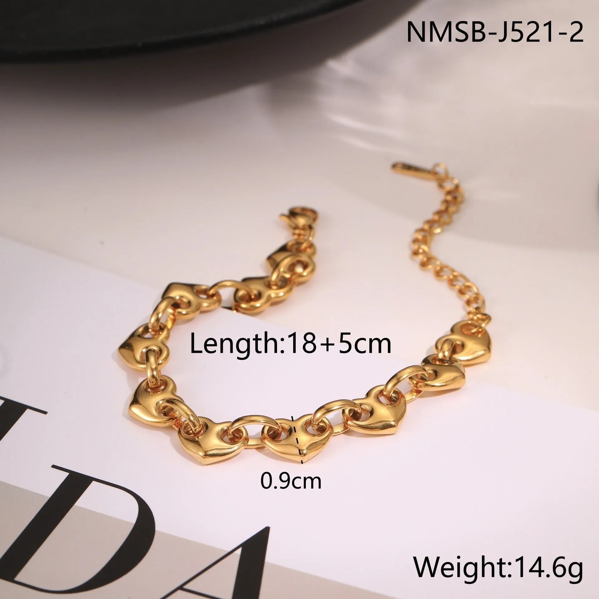 Hollowed-out heart bracelet in stainless steel with 18K gold plating showing simple geometric design