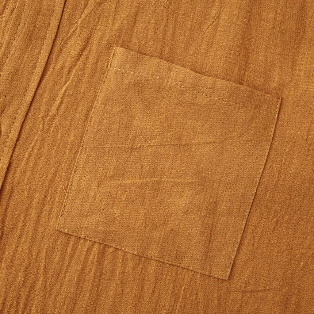 Brown men's slim fit long sleeve shirt and casual trousers set on a hanger.