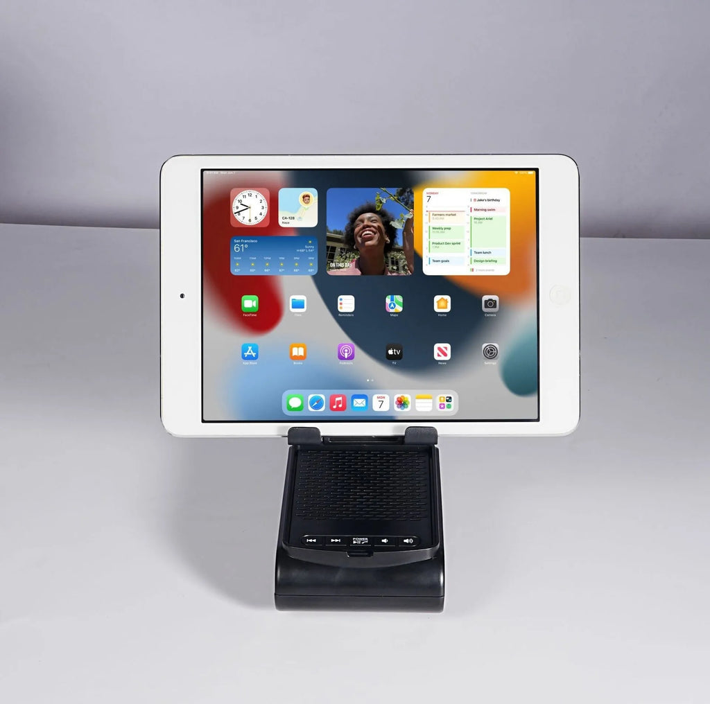 Multi-function lazy phone holder with Bluetooth speaker USB powered black white plastic