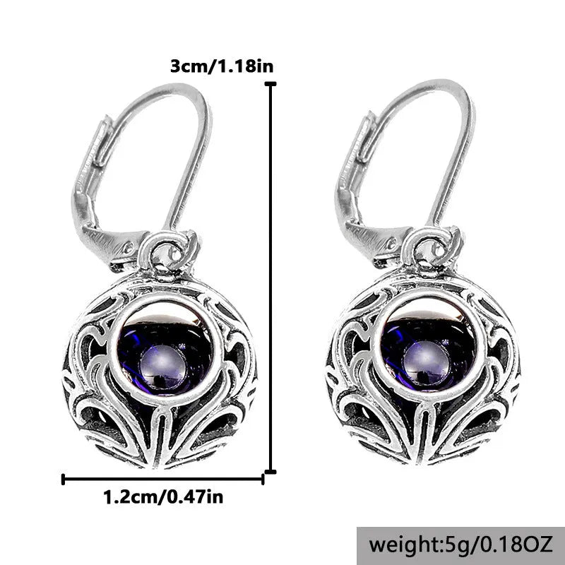 Vintage geometric blue gemstone pendant earrings with hollow engraving detail in silver-tone zinc alloy