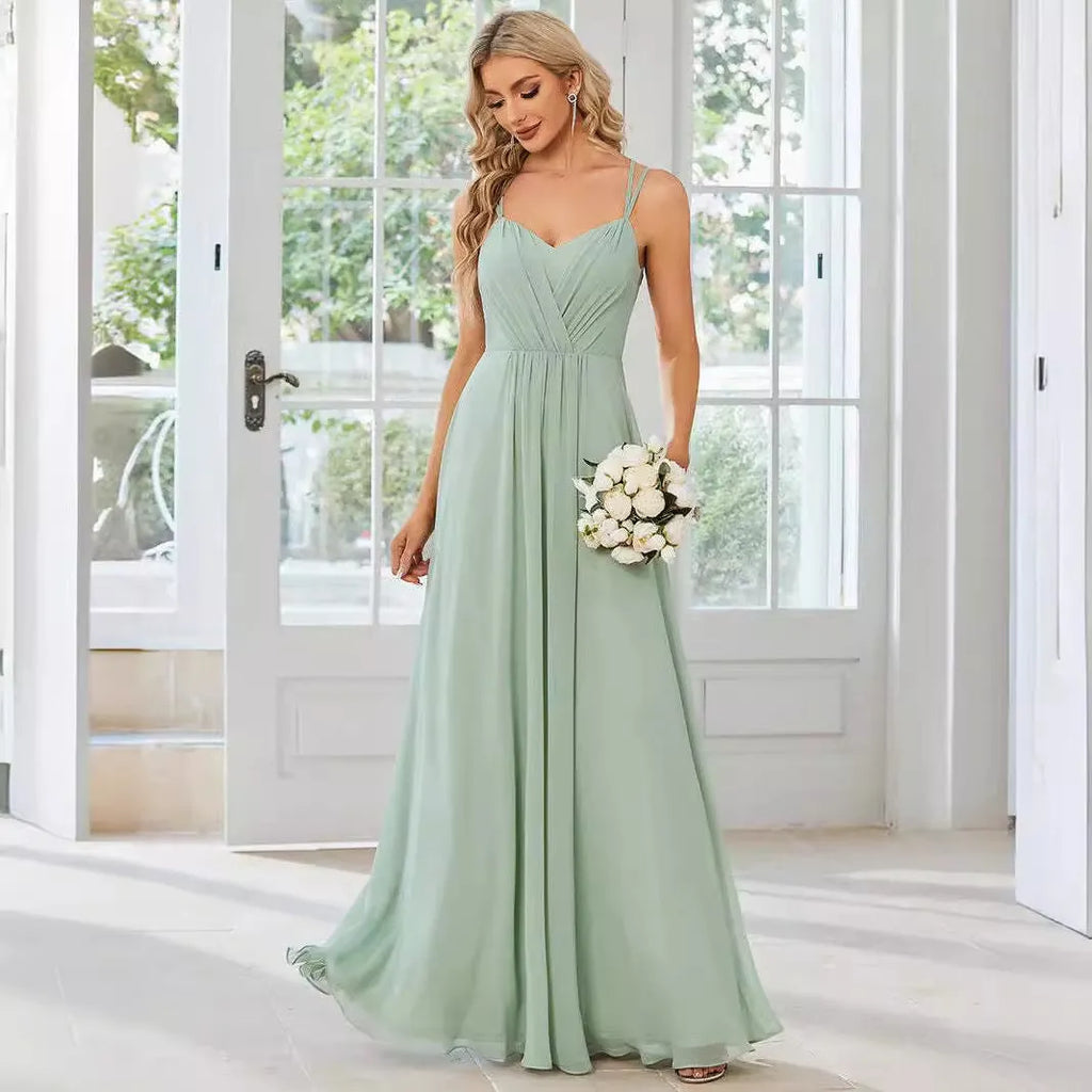 Women's long sleeveless A-line pleated dress in light green for banquet or casual wear.