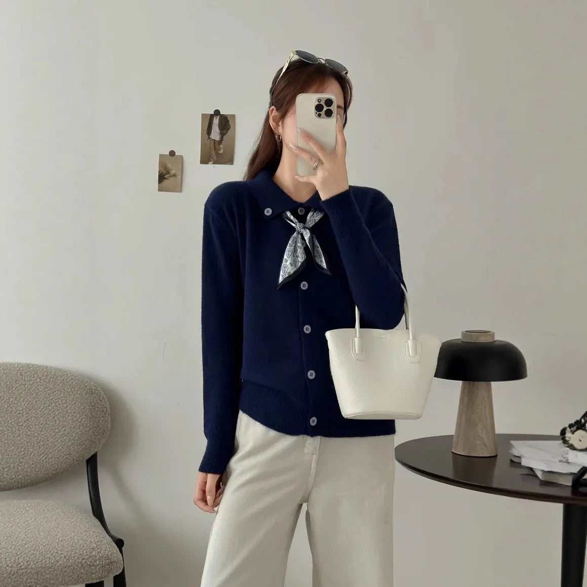 Beige lapel scarf collar acrylic cardigan with long sleeves on a hanger