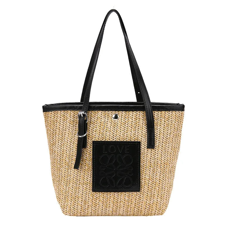 Straw woven women's shoulder bag in black showing European retro style with three-dimensional pocket