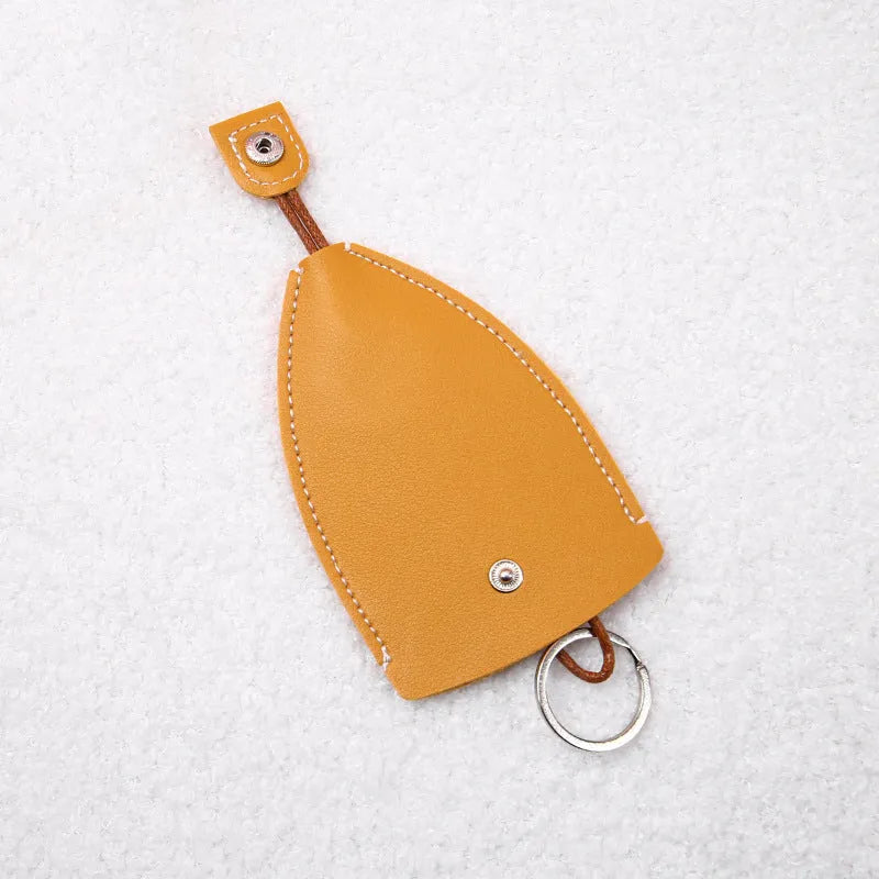 Cartoon design pull-out car key case made from soft PU leather, showing approximate size.