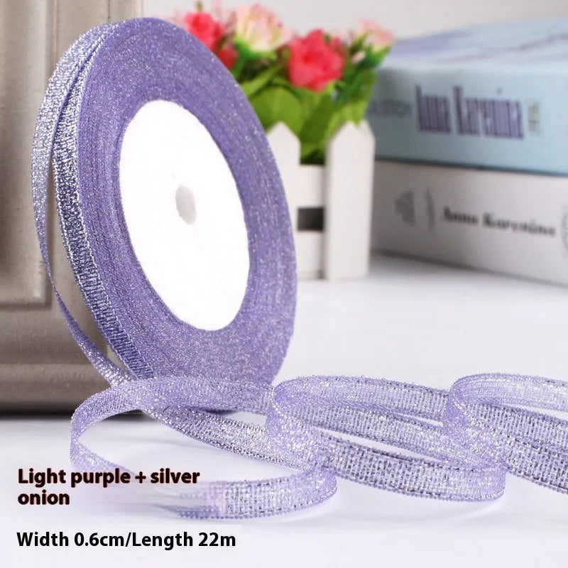 Roll of narrow 0.6cm wide polyester gift wrapping ribbon in assorted colours, showing 22 metre length.
