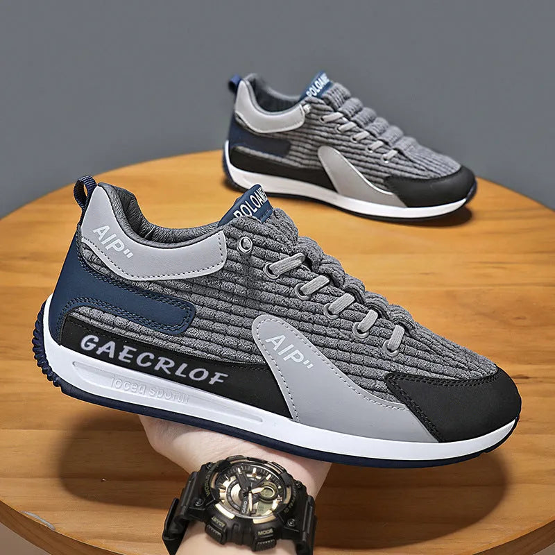Men's grey and green mesh running shoes with lace-up front and low-top design