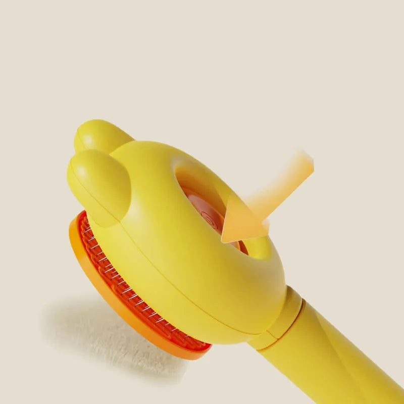 Green self-cleaning pet grooming brush with a stainless steel comb and a comfort-grip handle.