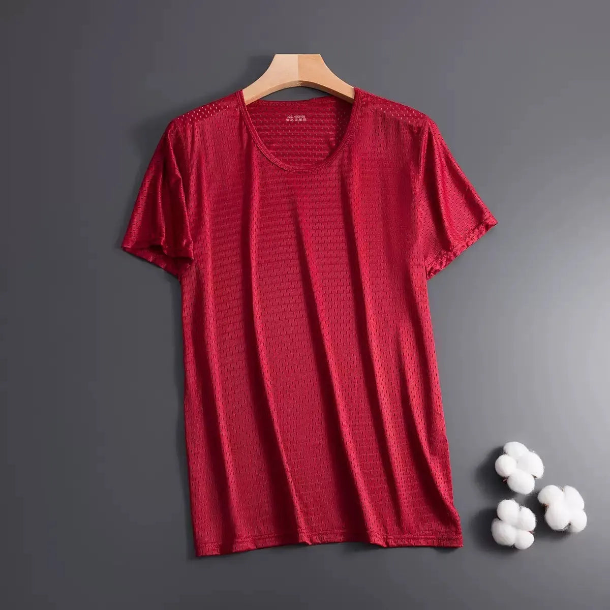 Man wearing ice silk short sleeve crew neck t-shirt in solid colour with thin mesh fabric