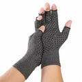 Grey half-finger joint compression gloves made from polyester and spandex fabric, shown on a hand.