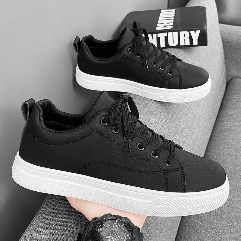 Men's low-top white breathable sneakers with a rubber sole on a plain background