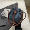 Blue synthetic leather cross body bucket bag with adjustable strap and sandwich pocket
