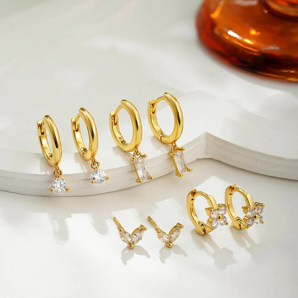 Geometric square earrings set with star shapes in gold or silver metallic finish
