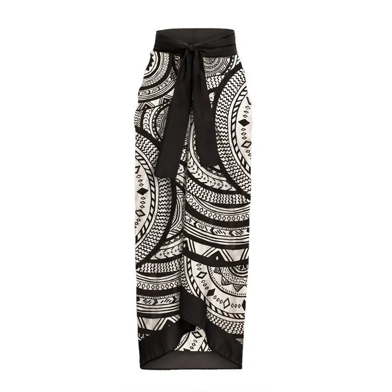 Women's vintage print deep V one-piece swimsuit with ruffles and matching wrap skirt on a mannequin
