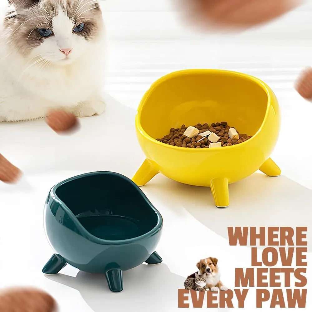 Green ceramic pet food bowl with four-legged base and rounded arc design