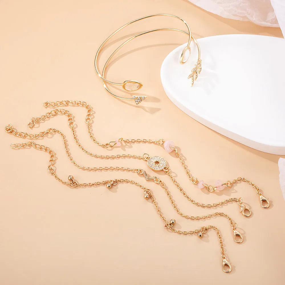 Golden spot drill charm bracelet set with arrow and water drop shapes