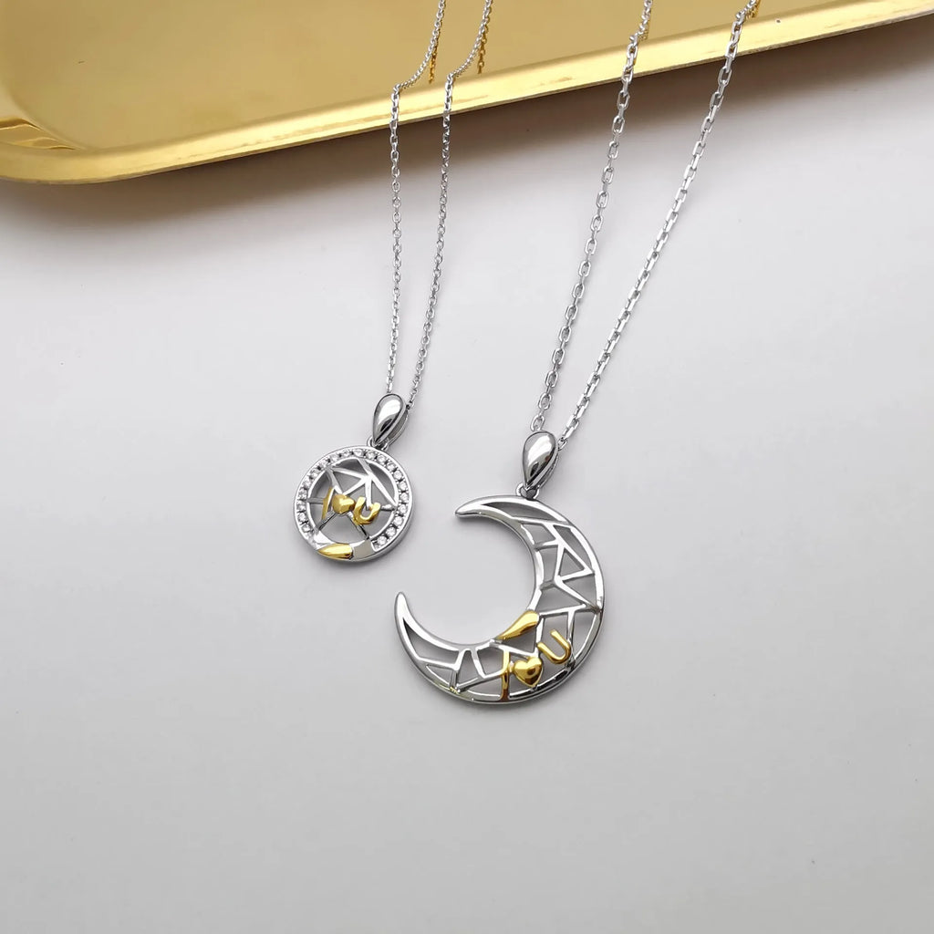 Sun Moon couple necklace set with copper electroplated pendants on a cross chain.