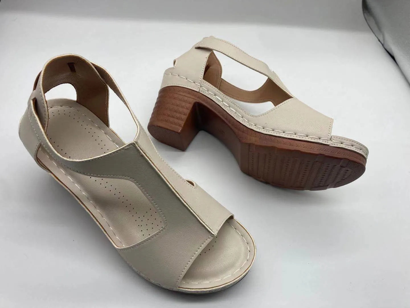 Women's white peep toe wedge sandals with Roman style buckle and low heel
