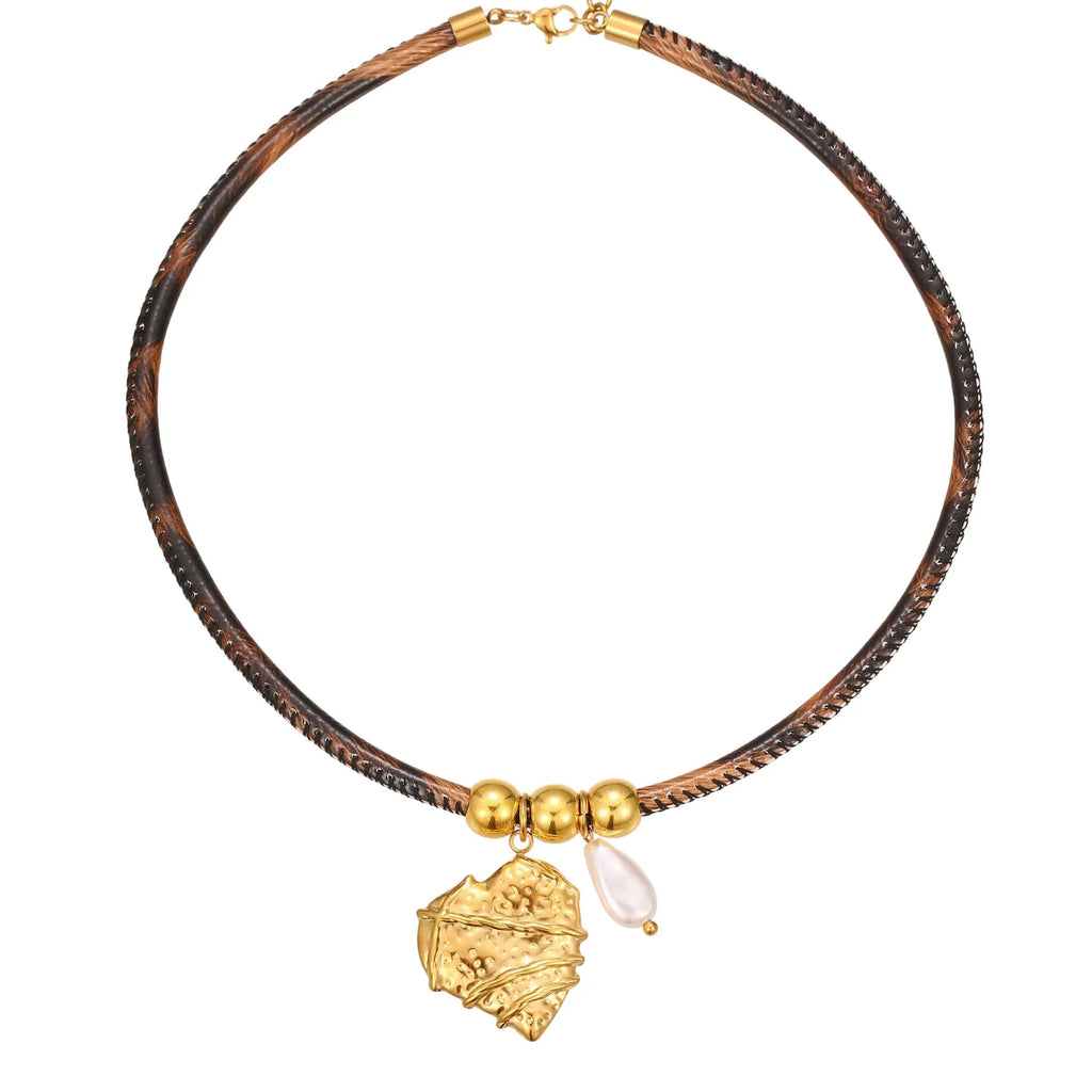 Geometric leopard print pendant on a stainless steel necklace chain with gold electroplated finish.