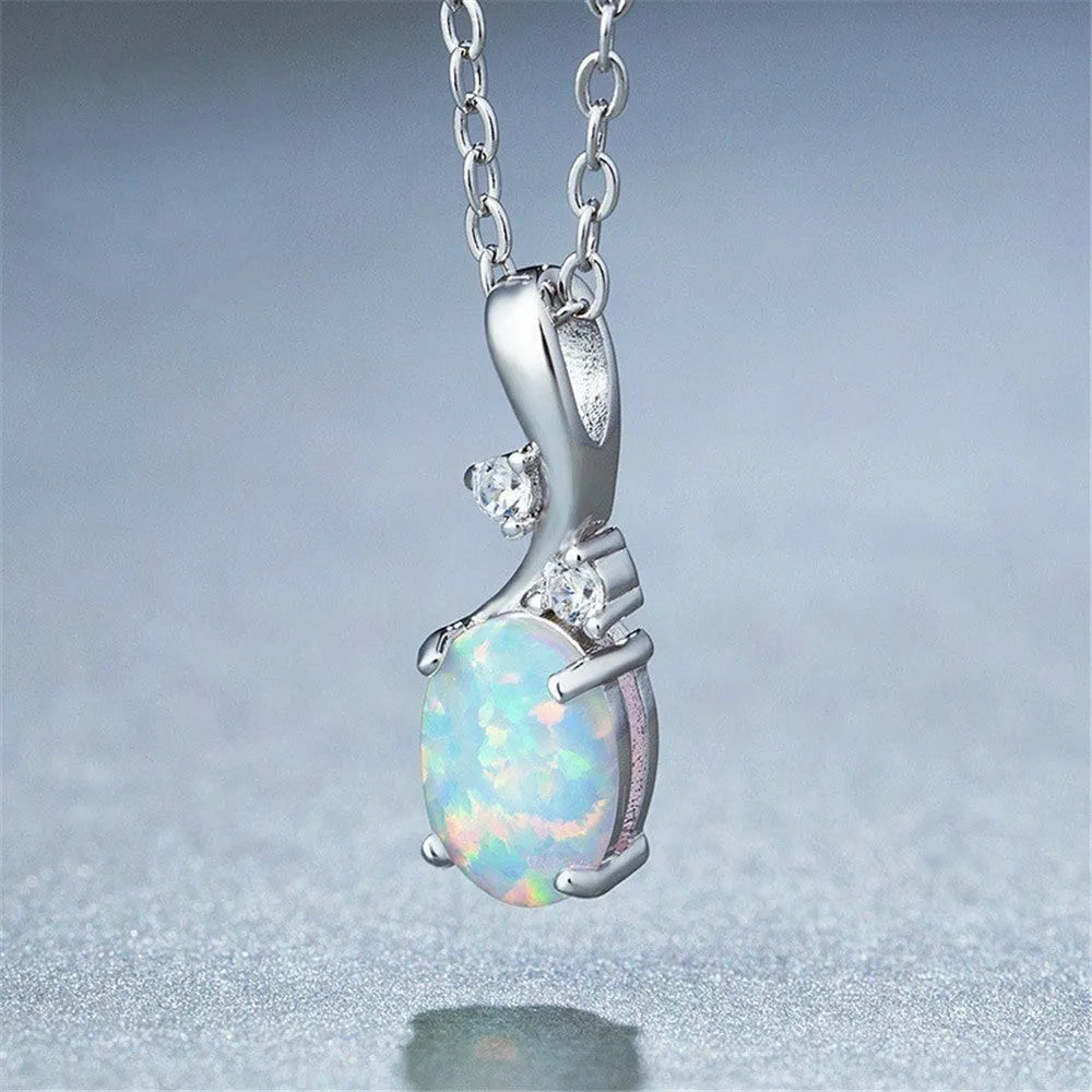 Water drop shaped opal pendant necklace with adjustable O-chain in rose gold or white electroplated finish.