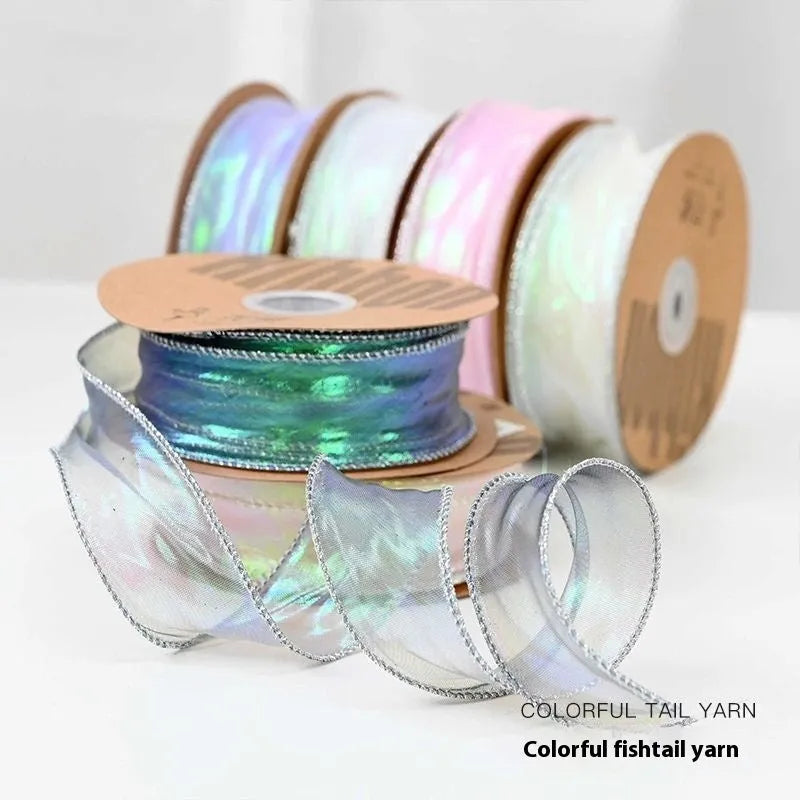 Roll of 4cm wide mesh fishtail yarn floral wave ribbon in multiple illusion colours.