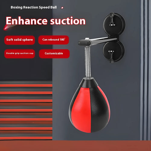 Pear-shaped black PU boxing reaction ball mounted on a wall with double suction cups for home training.