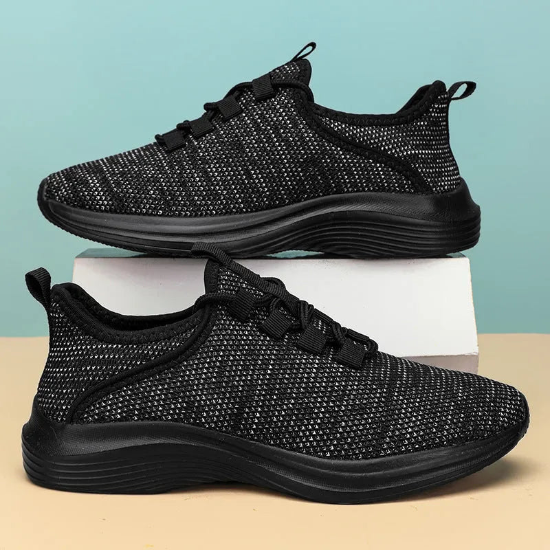 Women's low-top casual sneakers in mesh with lace-up front and EVA sole, shown in black colour.
