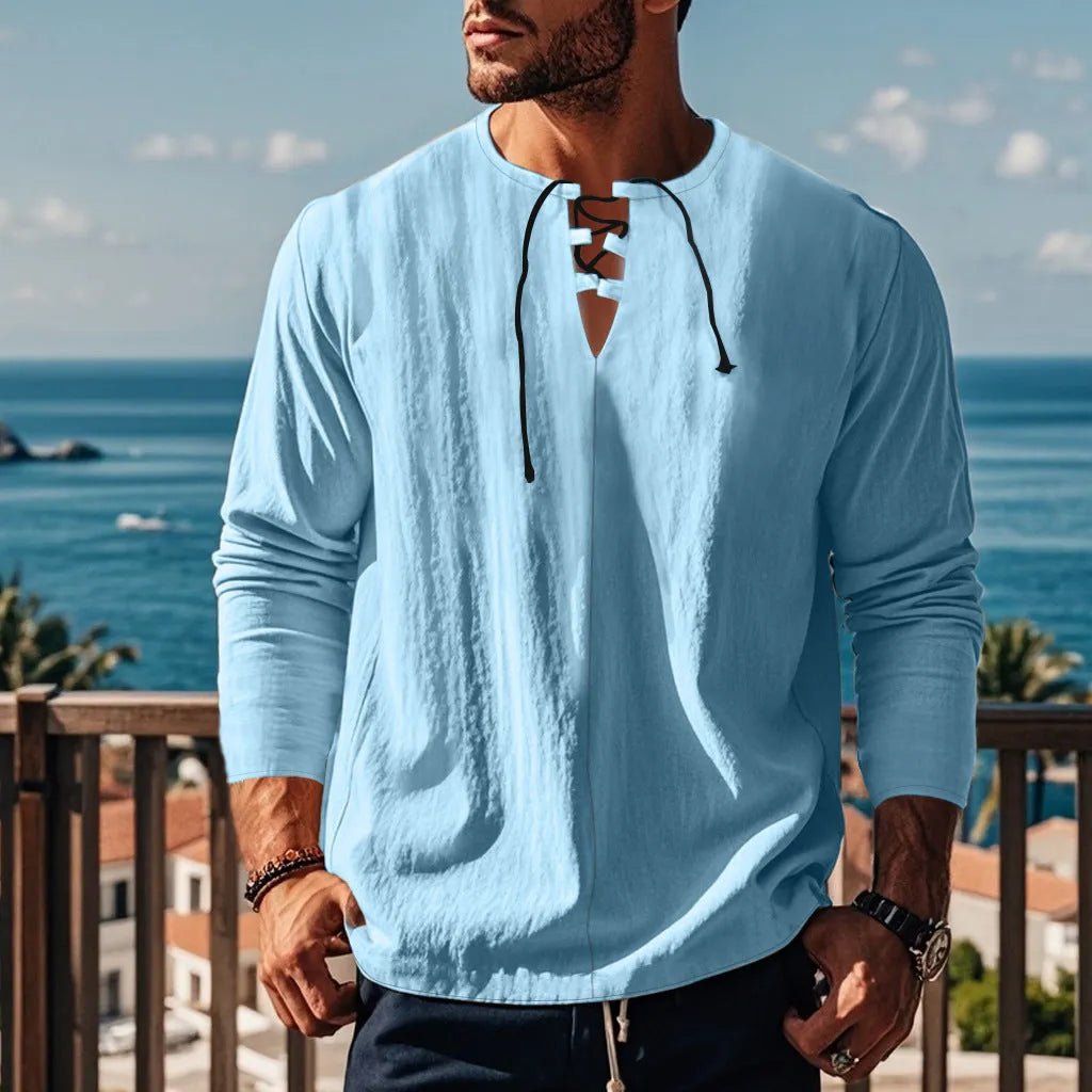 A man wearing a loose-fit solid colour cotton linen blend casual shirt.