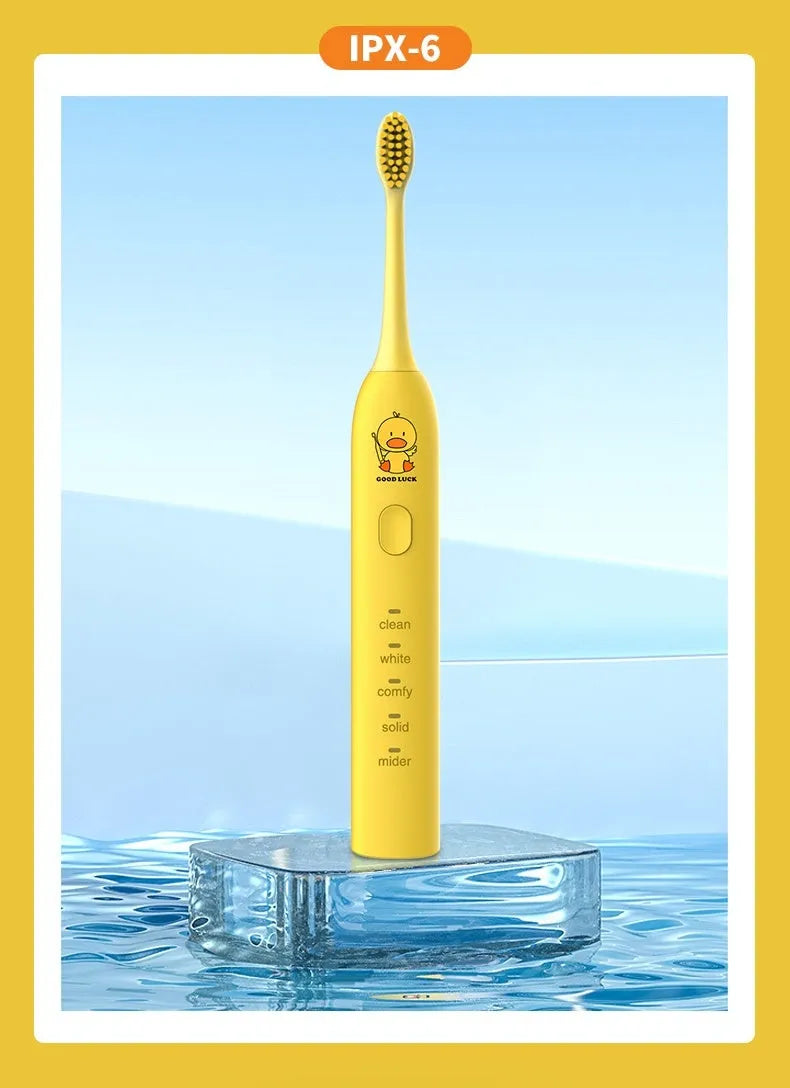 USB rechargeable electric toothbrush in yellow with small duck design and soft bristle head