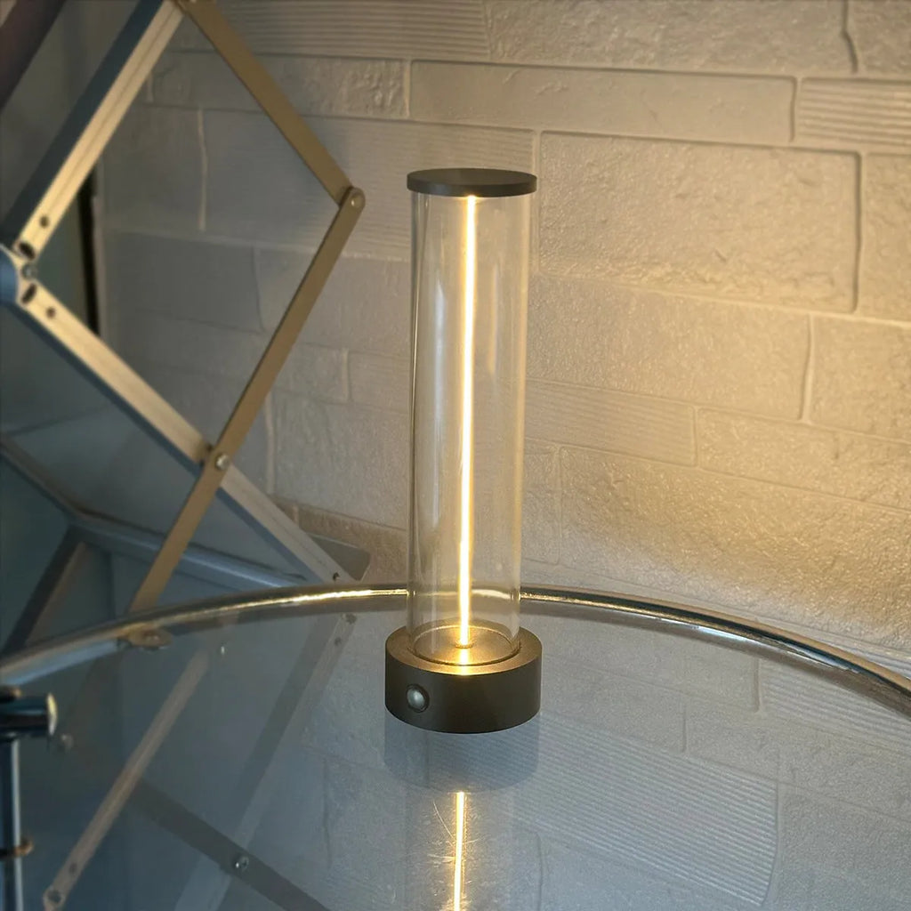 Grey modern LED line glass light strip with magnetic suction base for USB charging.