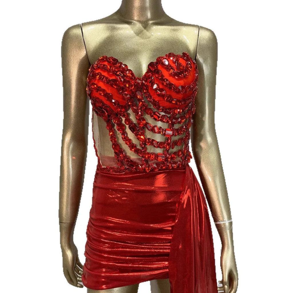Red women's skirt suit with mesh see-through panels, a stage and party costume.