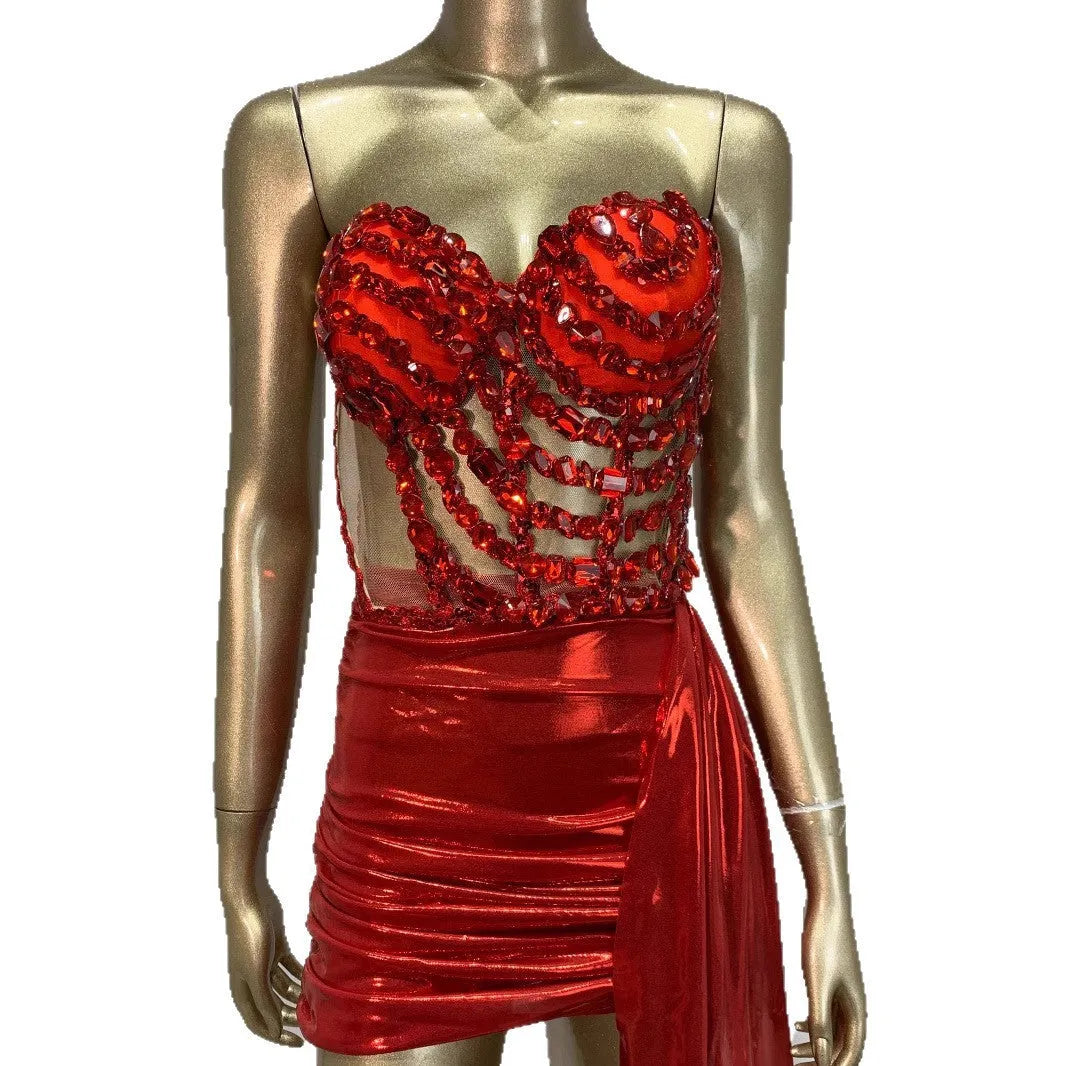 Red women's skirt suit with mesh see-through panels, a stage and party costume.