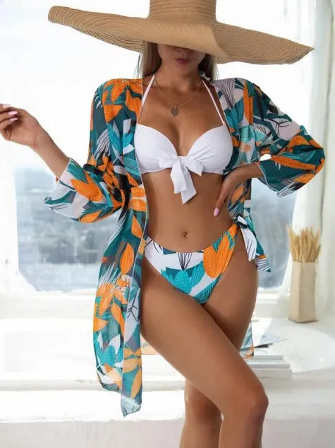 Women's three-piece polyester bikini swimsuit set with mesh detail in a conservative cut