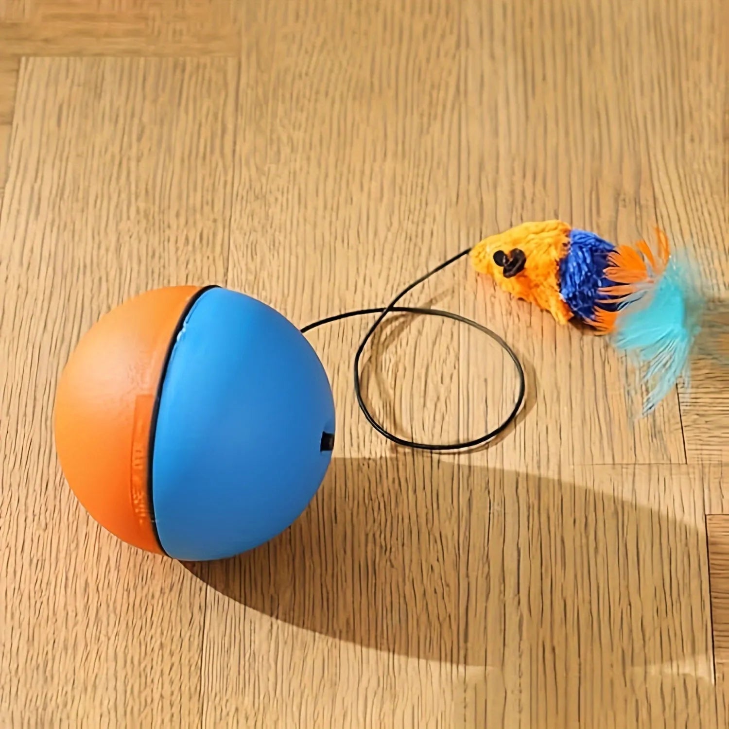 Interactive cat toy with blue and orange removable plush mouse attached to ball for feline exercise