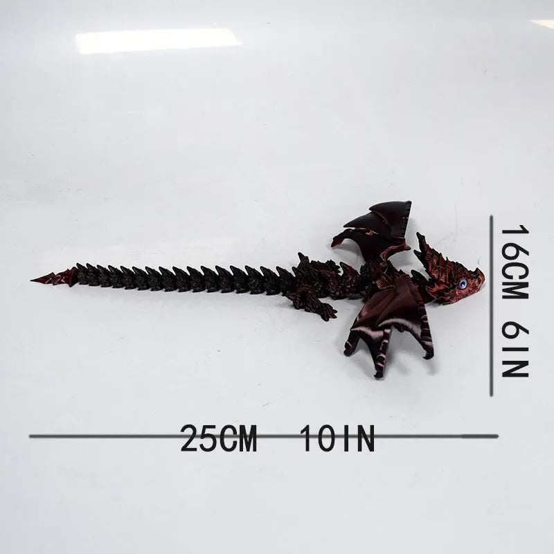 Red and gold 3D printed dragon wings toy decoration on a white background.