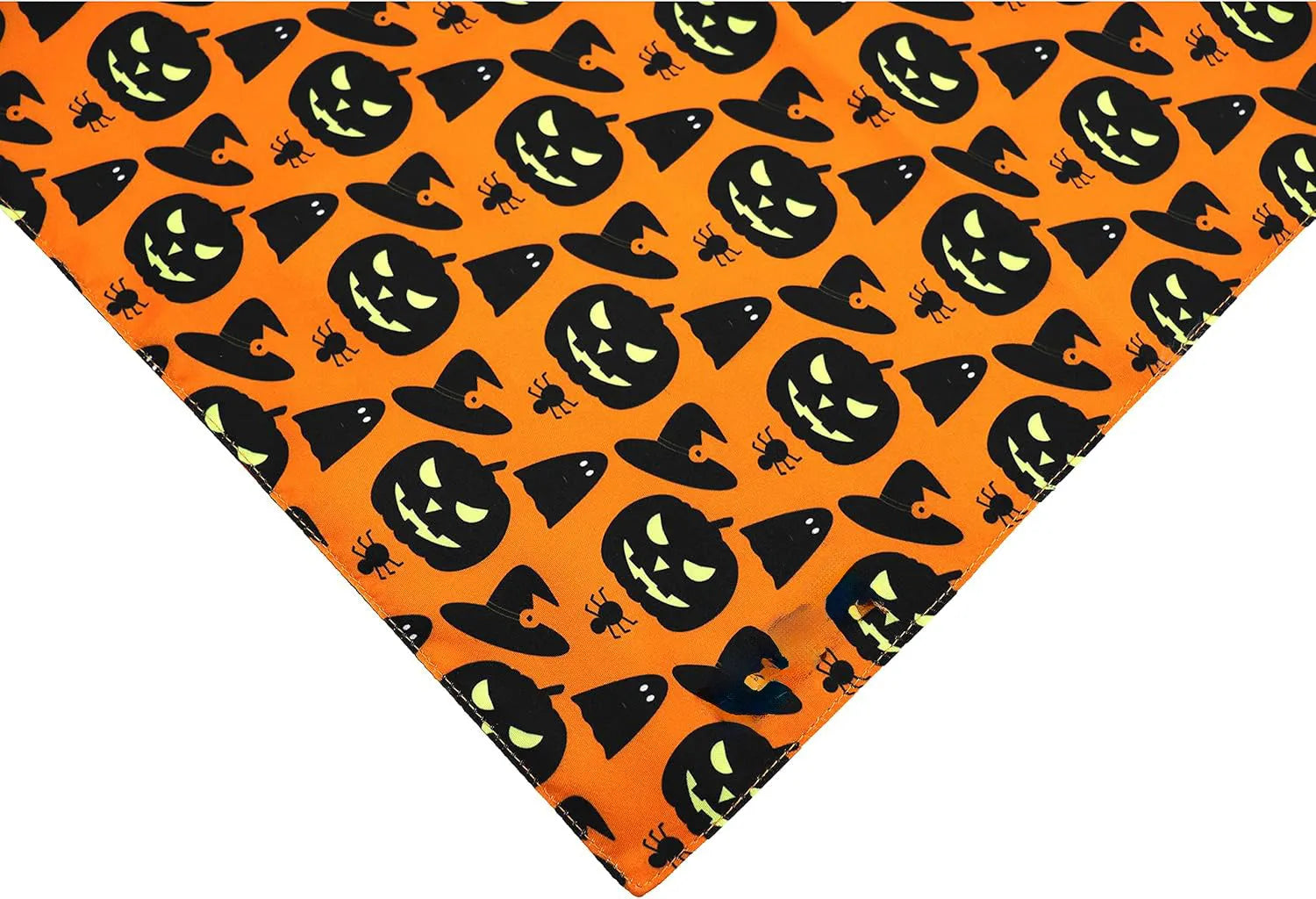 Black and orange reversible Halloween dog bandana with pumpkin and spider web patterns laid flat.