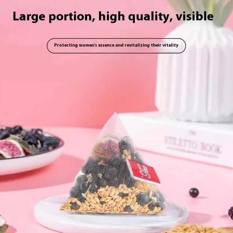 Black Wolfberry Tea bags with mulberry, fig and flaxseed ingredients in packaging with cup