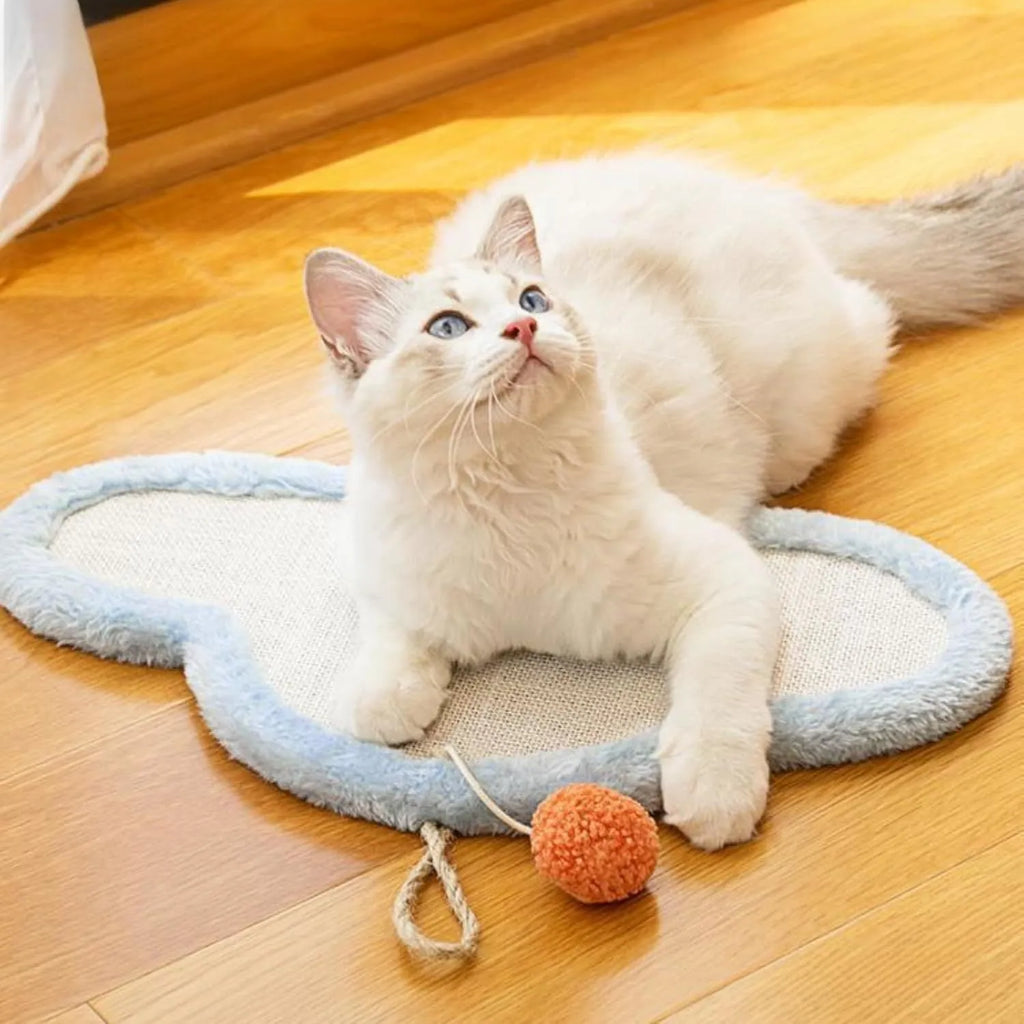White wall-mounted cat scratching mat with cartoon sleeping cat design made from natural sisal.