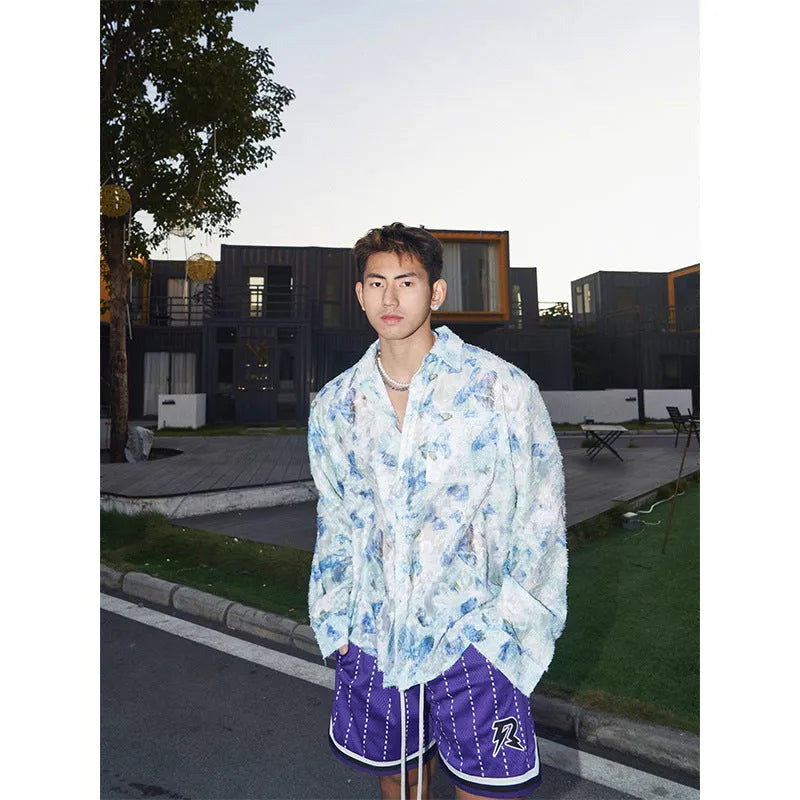 Long sleeve floral shirt with three-dimensional embossed pattern in loose fitting blue version