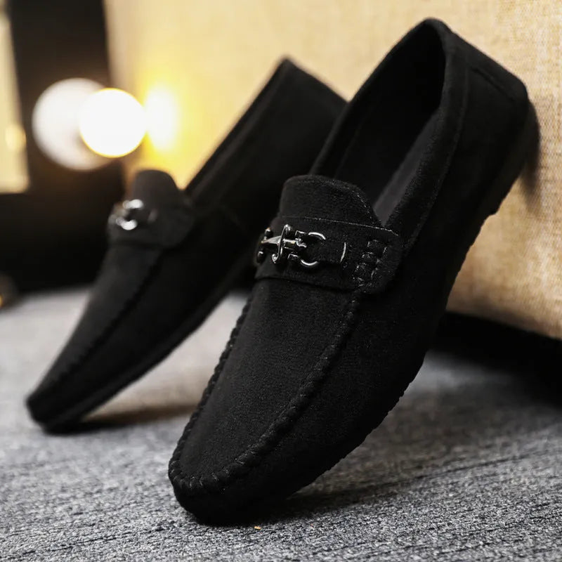 Men's waterproof black slip-on loafers with round toe and low stiletto heel on a rubber sole.