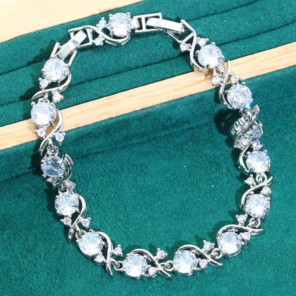 Bridal zircon necklace, earrings, ring, and bracelet four-piece jewellery set in alloy.
