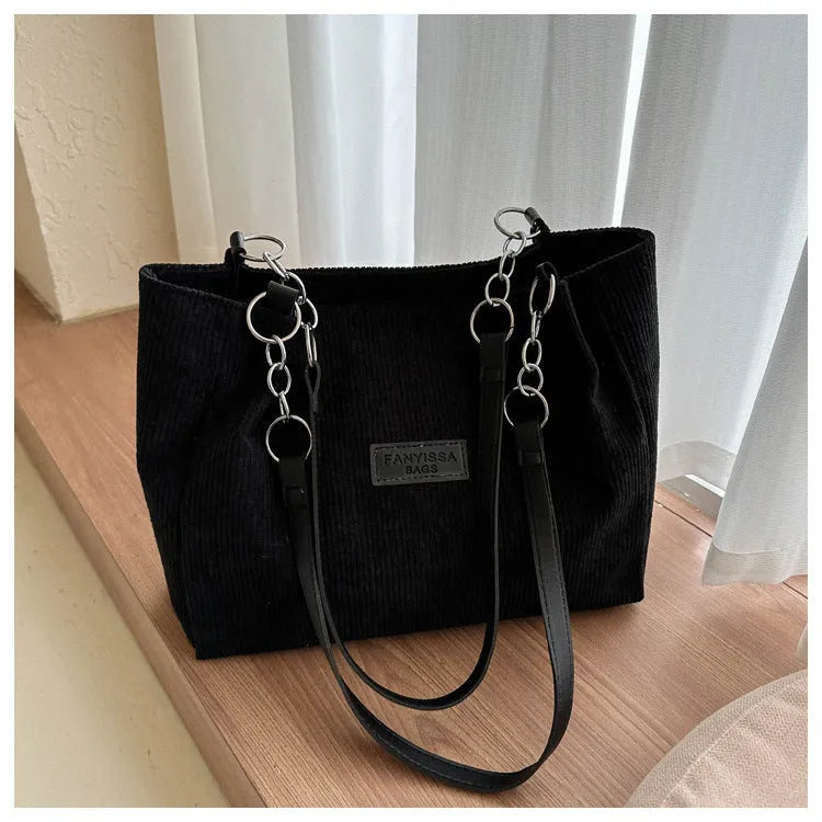 Corduroy one-shoulder tote handbag in street style with three-dimensional pocket