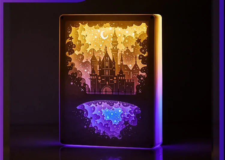 Bedside night light with paper carving design and remote control on wooden nightstand